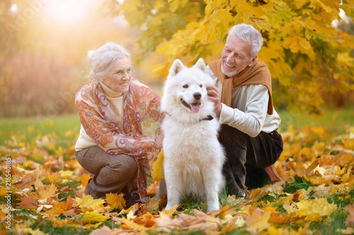 Obraz na płótnie portrait of beautiful caucasian senior couple with dog