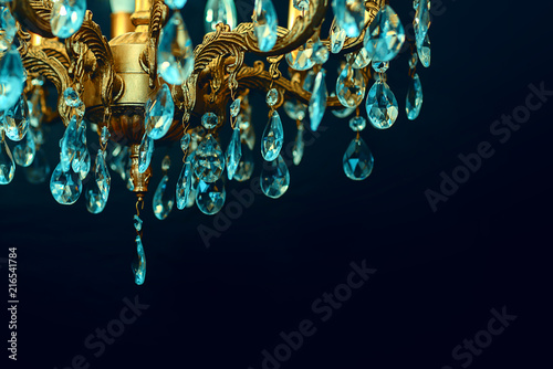 Crystal chandelier close-up. Dark background