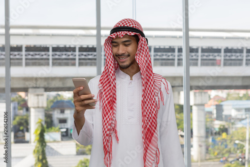 Arabian arab businessman happy looking on mobile phone