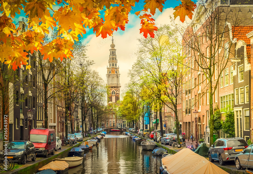 South Church Zuiderkerk over fall canal in Amsterdam, Netherlands