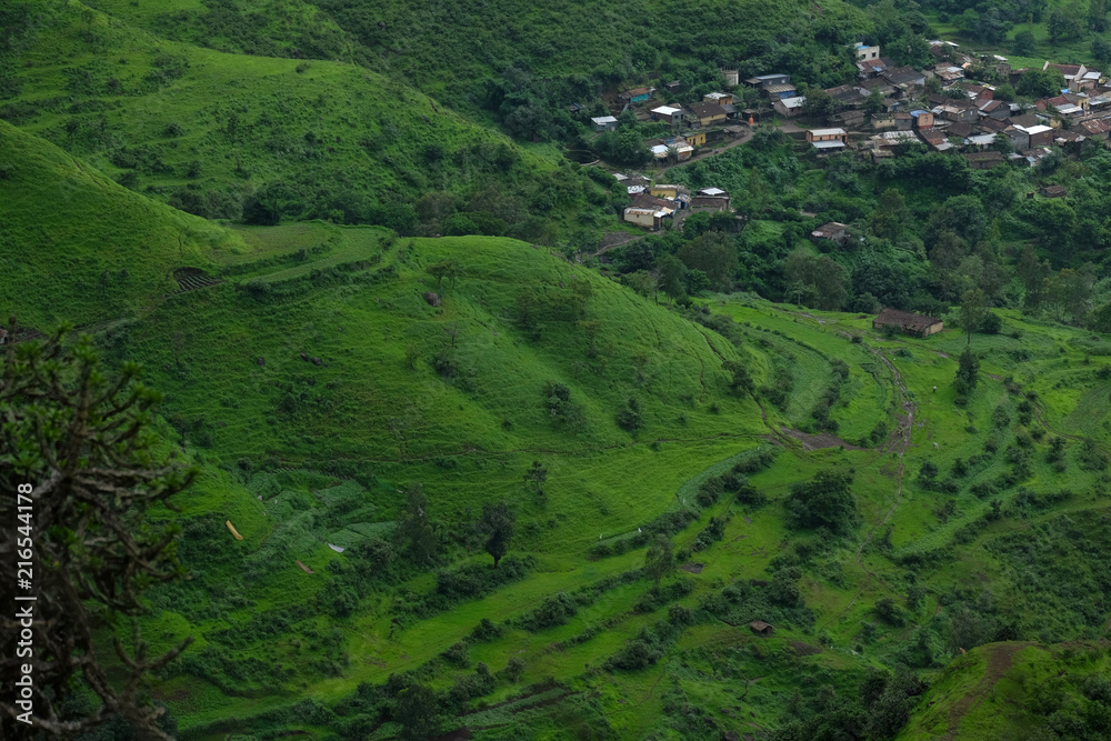Lush green monsoon nature landscape mountains, hills, Purandar, Pune, Maharashtra, India Lush green monsoon nature landscape mountains, hills, Purandar, Pune, Maharashtra, India
