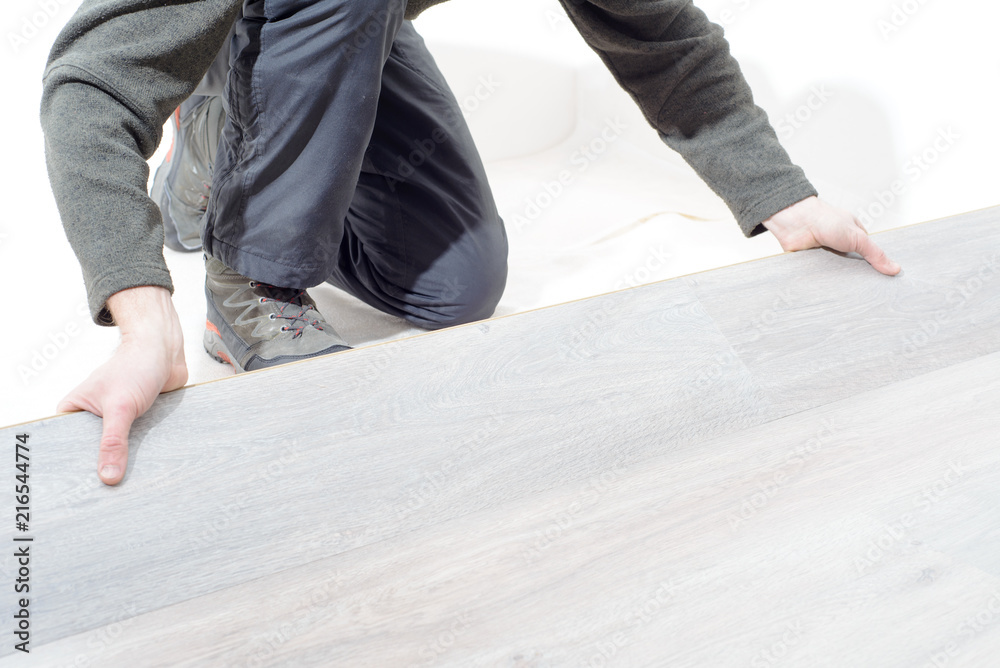 installing new laminated wooden floor. copy space installing new laminated wooden floor. copy space