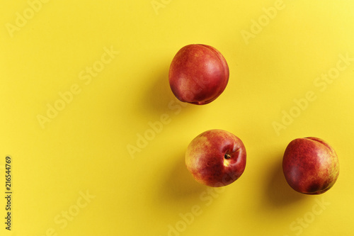 ripe nectarine on a yellow background