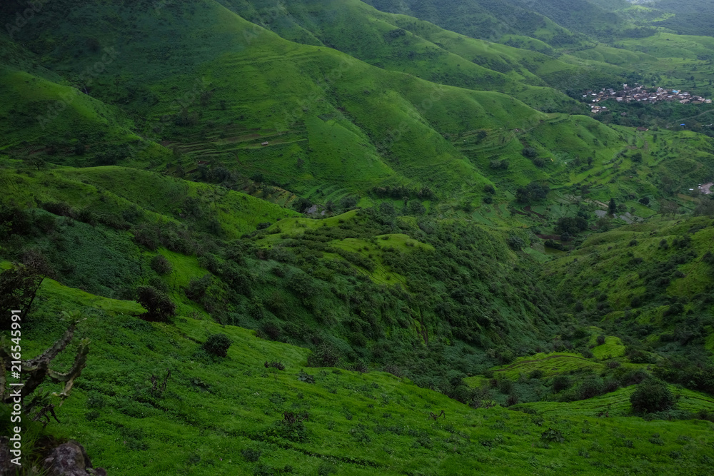 Lush green monsoon nature landscape mountains, hills, Purandar, Pune, Maharashtra, India  - obrazy, fototapety, plakaty 