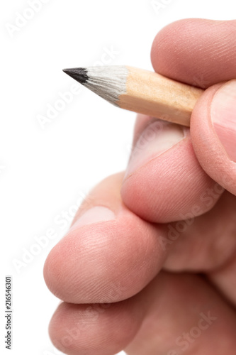 Close-up fingers holding a pencil, isolated on white background