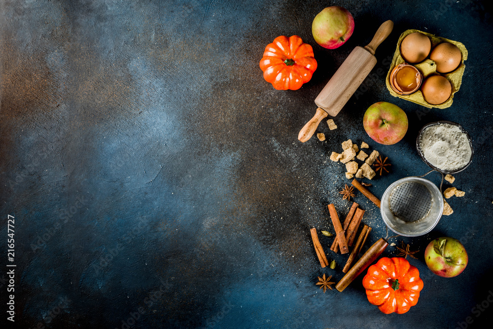 Sweet autumn baking concept, cooking background with baking accessories, flour, rolling pin, decorative pumpkins, apples, cinnamon spices with anise cardamom sugar. Sweet autumn baking concept, cooking background with baking accessories, flour, rolling pin, decorative pumpkins, apples, cinnamon spices with anise cardamom sugar.