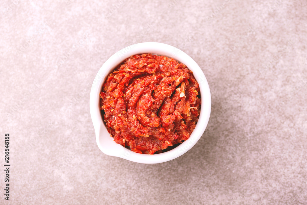 Traditional Maghrebi hot chili pepper sauce paste harissa. adjika Traditional Maghrebi hot chili pepper sauce paste harissa. adjika