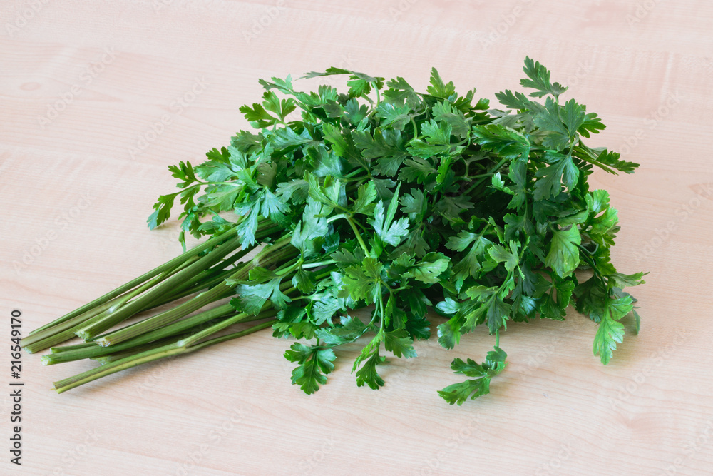 Fresh parsley on wooden table. Healthy food. Fresh parsley on wooden table. Healthy food.