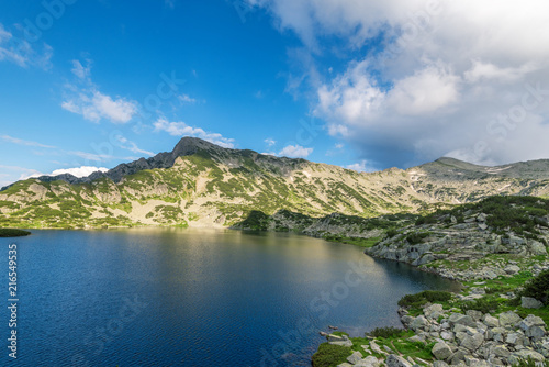 Popovo lake at Bezbog, Bulgaria and mountains reflection.