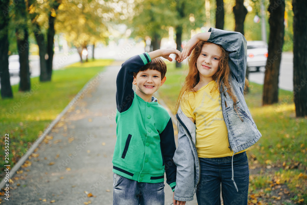 Children holding hands in autumn park. Children holding hands in autumn park.