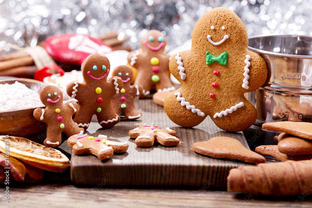  Homemade gingerbread cookies with ingredients for christmas baking