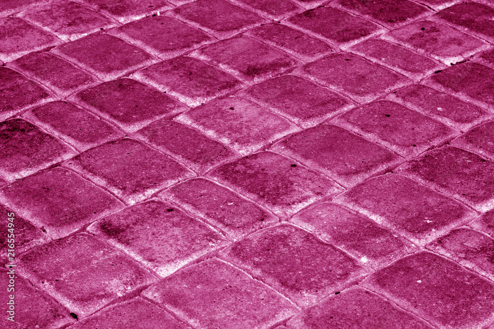 Fototapeta premium Cobble stone pavement in pink tone.