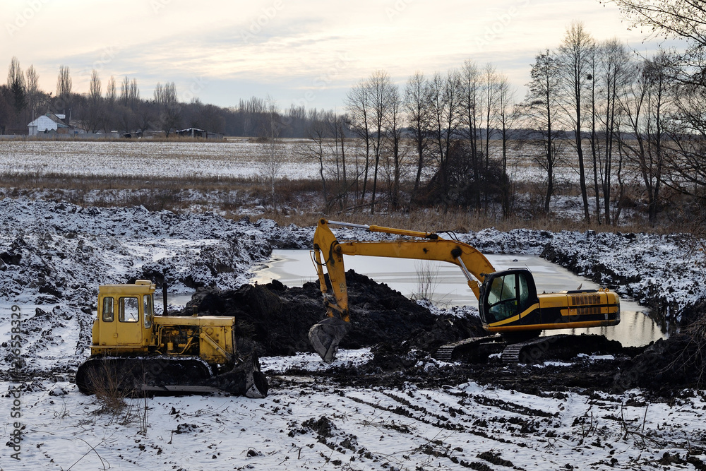 yellow excavator and bulldozer
