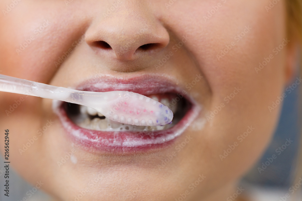 Fototapeta premium Woman brushing cleaning teeth