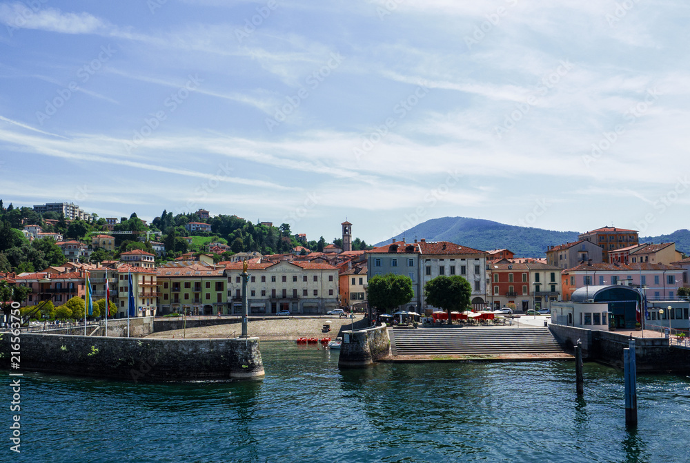 Luino, the beautiful town seen by tourists arriving by boat. Lake Maggiore, Italy
