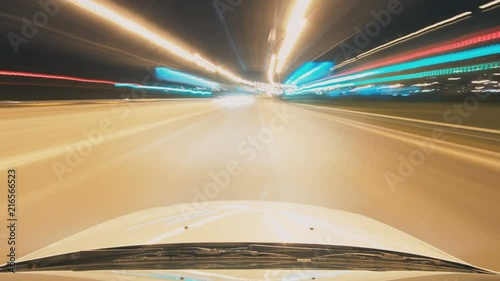 Night time lapse driving cars around the city with beautiful view lights from the roof car