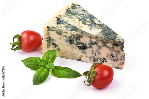 Wedge of soft blue cheese with mold and cherry tomatoes with basil leafs, isolated on white background photo