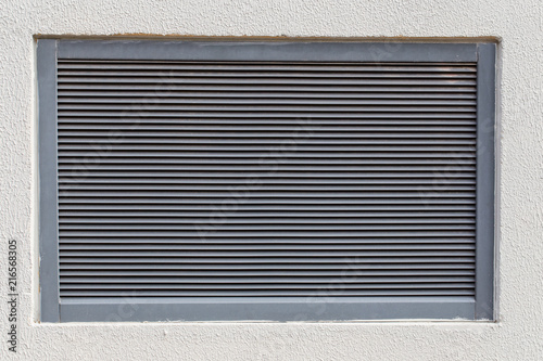 Ventilation grid on white wall