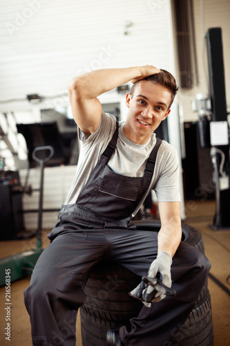 A man at his work at autoservice during a break