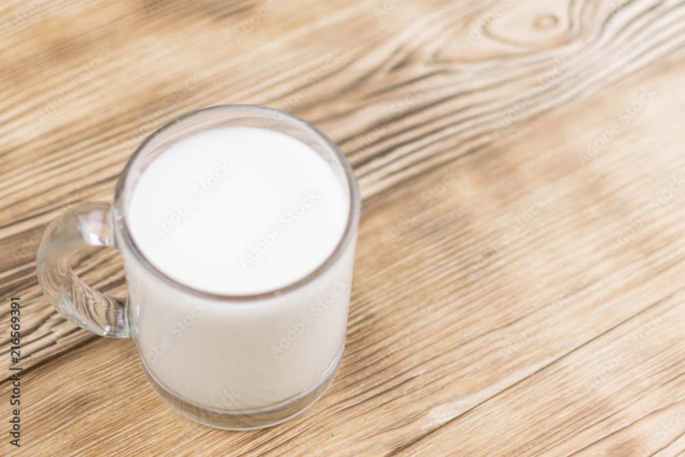 Glass kefir (milk) on a wooden background. The concept of diet, weight loss. Glass kefir (milk) on a wooden background. The concept of diet, weight loss.