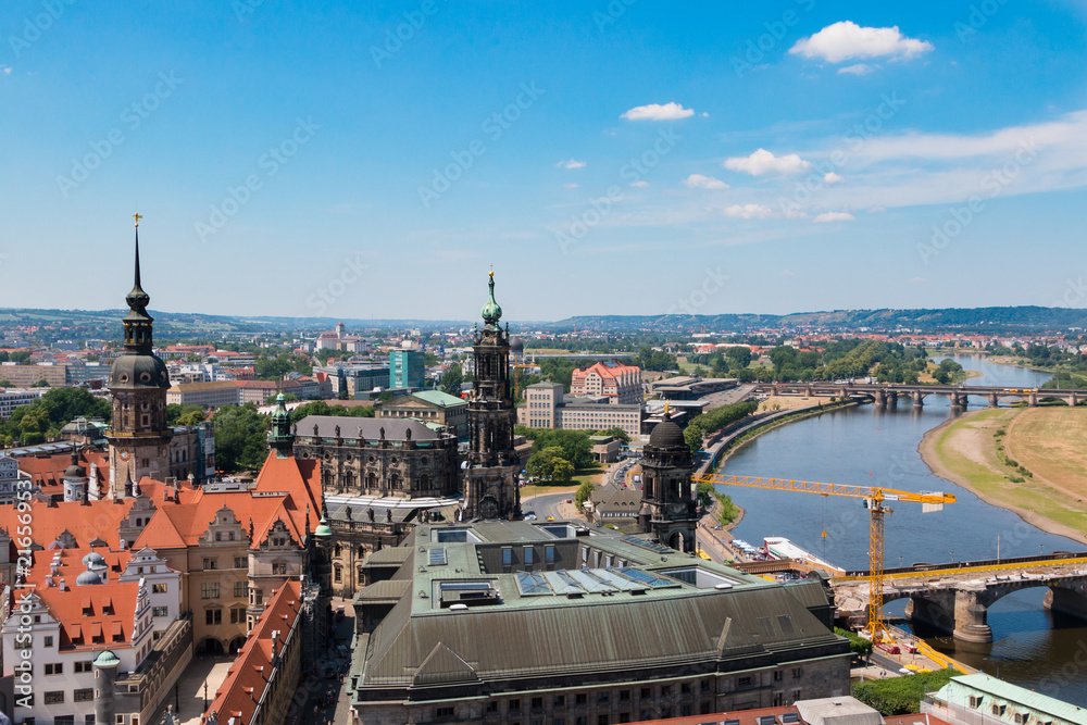 Fototapeta premium View of one of the most beautiful cities in Europe and Germany - Dresden. Panorama of the old and modern city. The valley of the river Elbe. Tiled roofs and well maintained houses.
