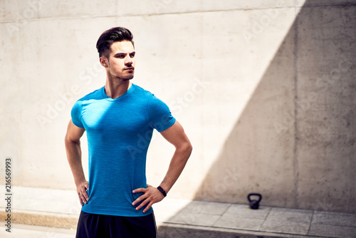 Portrait of athletic and handsome man during urban workout session