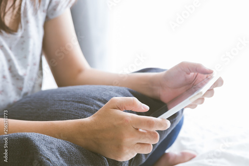 Freelancer using tablet working online at home.