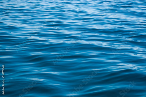 Deep blue water texture with some big and small waves © Martn