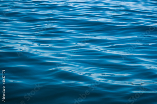 Deep blue water texture with some big and small waves © Martn