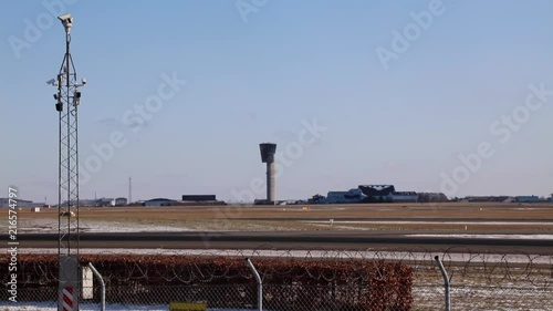 Airport airside with safety car racing over