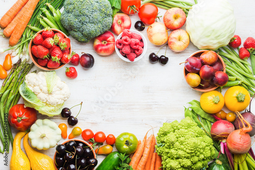 Fototapeta Naklejka Na Ścianę i Meble -  Fresh farm produce frame, fruits vegetables berries, apples cherries peaches strawberries cabbage broccoli cauliflower squash tomatoes carrots beans beetroot copy space, top view, selective focus