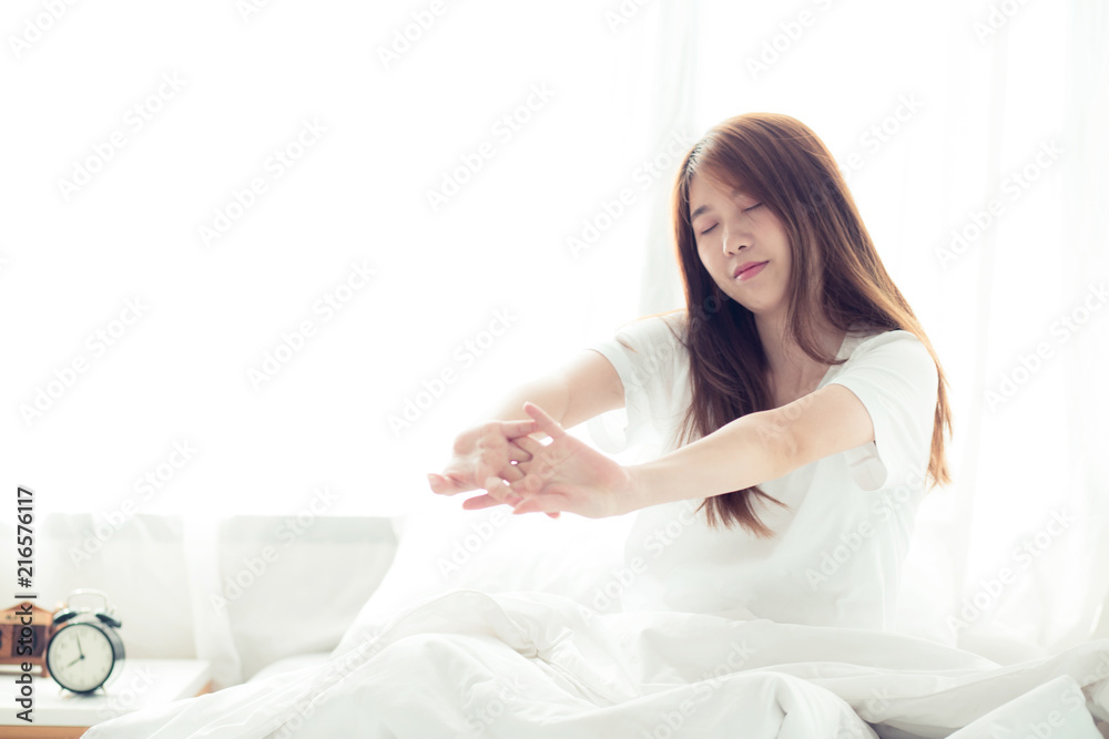 Beautiful young asian woman stretch and relax in bed after wake up morning at bedroom, back view, new day and resting for wellness, lifestyle concept. Beautiful young asian woman stretch and relax in bed after wake up morning at bedroom, back view, new day and resting for wellness, lifestyle concept.