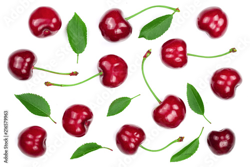 Sweet red cherries with leaves isolated on white background. Top view. Flat lay pattern