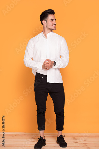 Handsome young man in elegant fashionable clothes photo