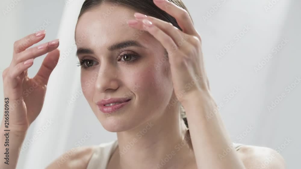 Face Skin Care. Beautiful Woman Touching Face Skin And Smiling Face Skin Care. Beautiful Woman Touching Face Skin And Smiling