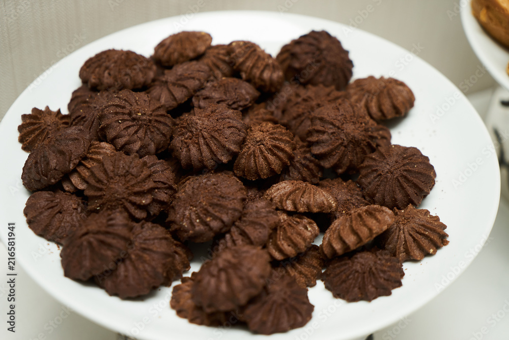 Cookies and sweet biscuits on white plate background, top view Cookies and sweet biscuits on white plate background, top view