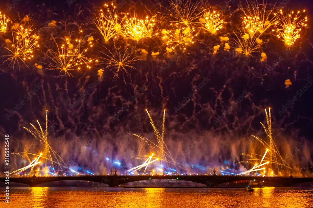 Fireworks on the bridge. Golden fireworks. Salute above the river. Celebration. Festive salute. Fireworks on the bridge. Golden fireworks. Salute above the river. Celebration. Festive salute.