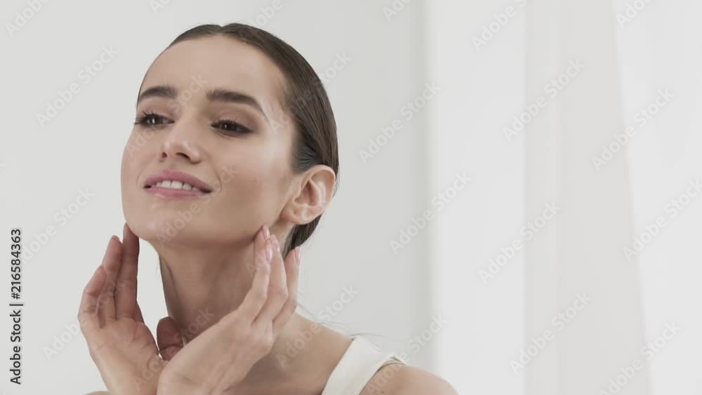 Beauty Care. Attractive Smiling Woman Caressing Face Skin Beauty Care. Attractive Smiling Woman Caressing Face Skin