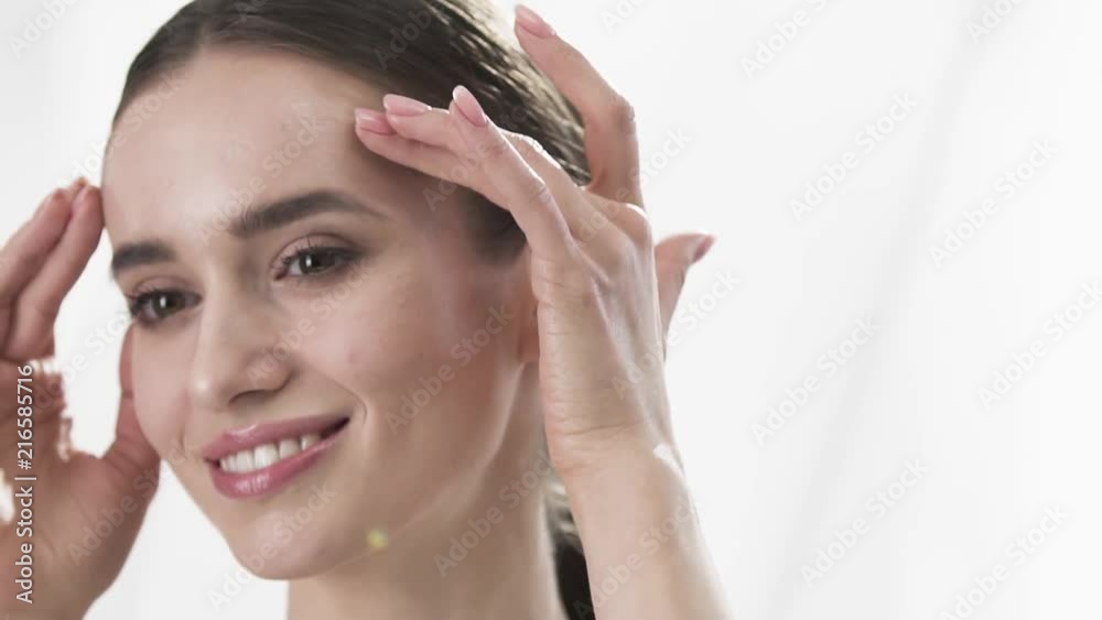 Face Skin Care. Beautiful Woman Touching Face Skin And Smiling Face Skin Care. Beautiful Woman Touching Face Skin And Smiling