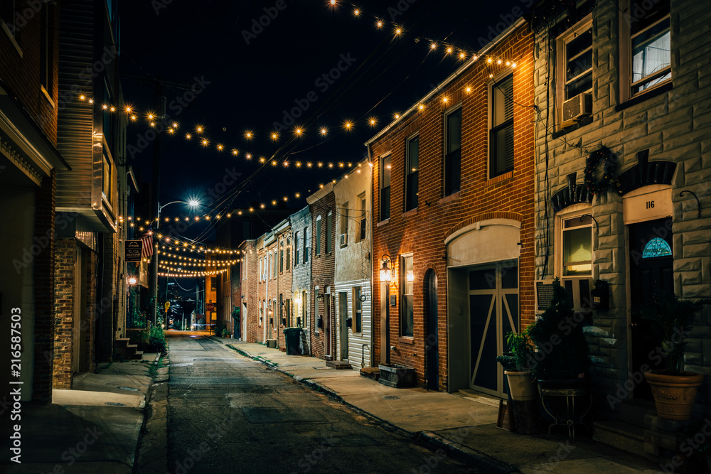 String lights over Chapel Street at night in Butchers Hill, Baltimore, Maryland