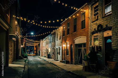 String lights over Chapel Street at night in Butchers Hill  Baltimore  Maryland
