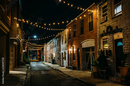 String lights over Chapel Street at night in Butchers Hill  Baltimore  Maryland