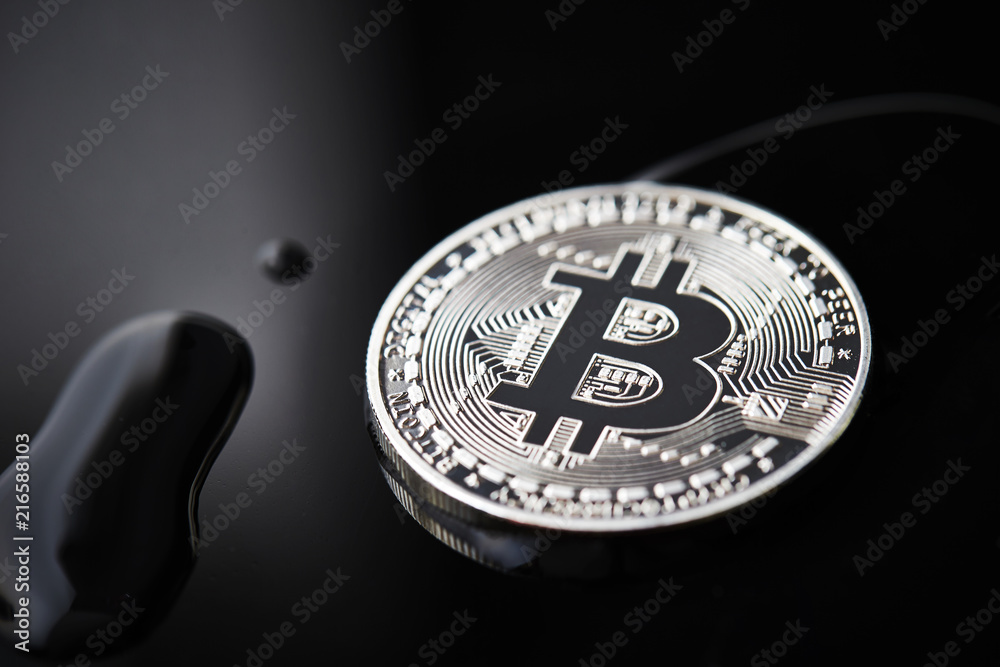 Silver bitcoin on black background 
