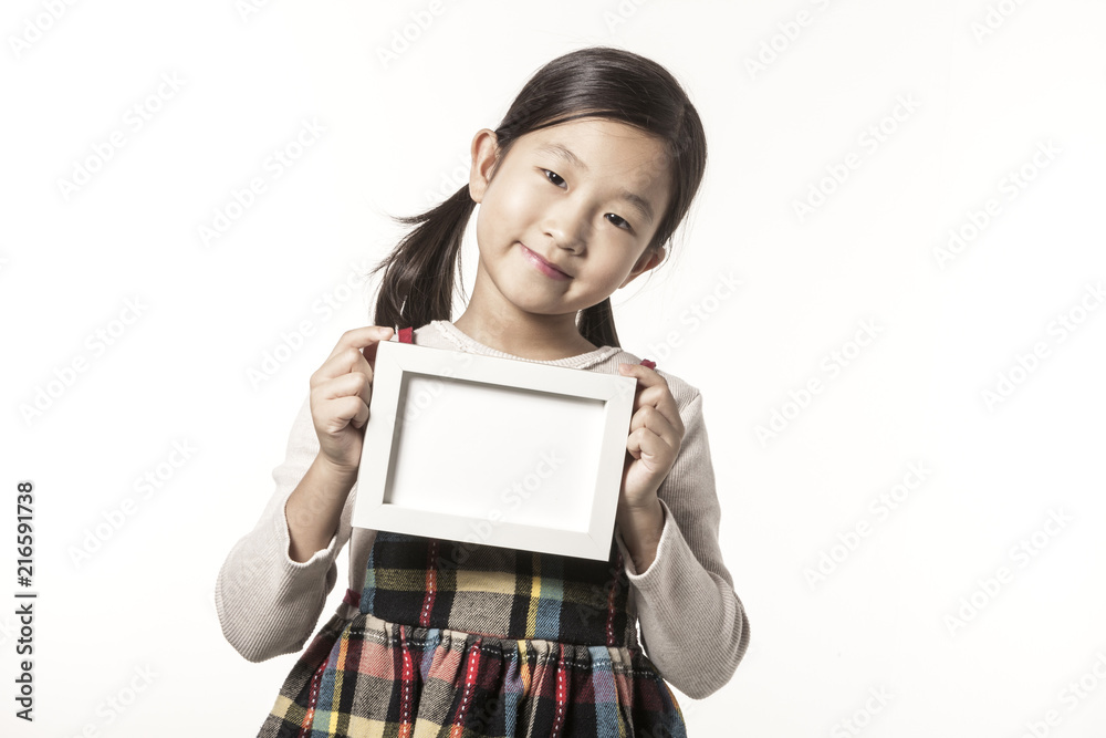 A girl hand hold a photo frame isolated white. A girl hand hold a photo frame isolated white.
