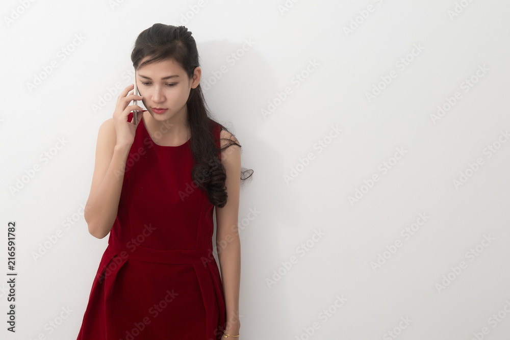 Worried young asian business woman with phone, Free from copy space. Worried young asian business woman with phone, Free from copy space.