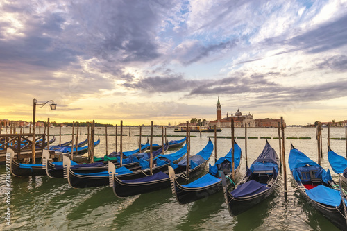 Venice sunrise city skyline and Venice Gondola boat, Venice Italy © Noppasinw
