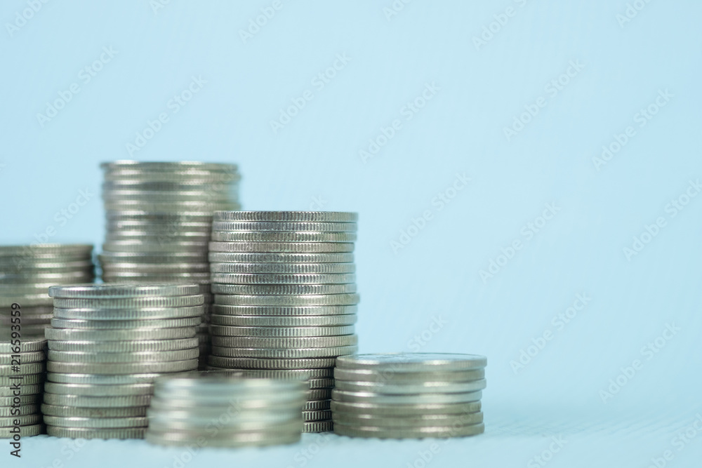 Step of coin stack with passbook or account book on wooden working table, savings and banking concept. Step of coin stack with passbook or account book on wooden working table, savings and banking concept.