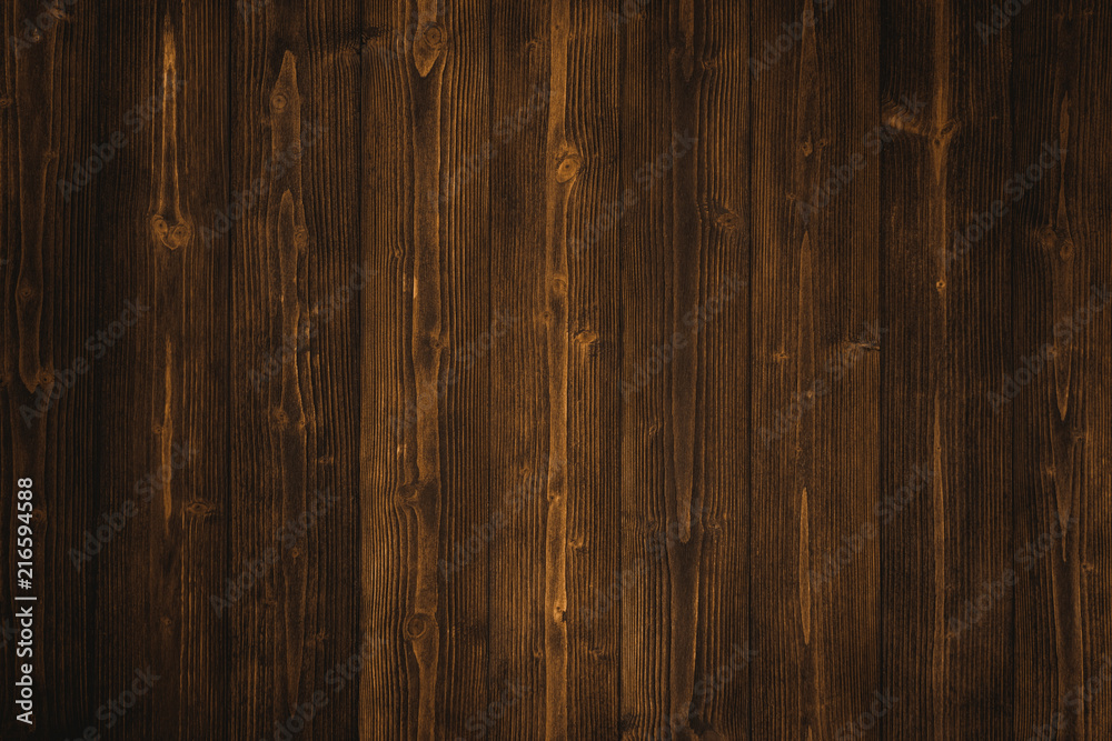 Naklejka premium Dark brown wood texture with natural striped pattern background