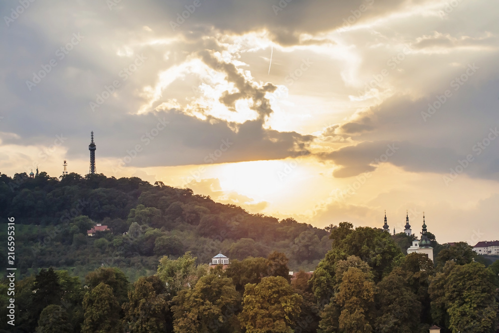 View on Petrin hill with Petrin lookout tower with beautiful sunset sky