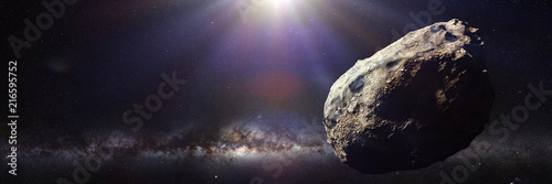 dwarf planet of the asteroid belt lit by Sun and Milky Way galaxy 